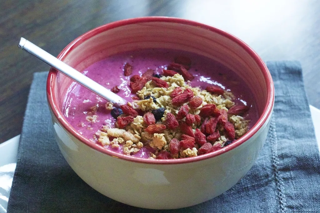 Fruit smoothie bowl photographed on a table, the kind of product shot a shop post is built around